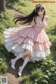 A woman in a pink and white dress is posing for a picture.